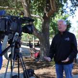 Mayor Stew giving an interview in front of a camera