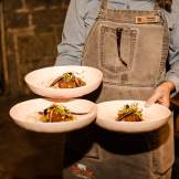 Server caring three dishes of food