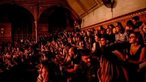 Crowd sitting in a venue
