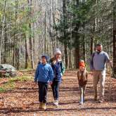 Family hiking on trail