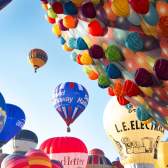 A group of balloons lifting off in a mass ascent at Bristol International Balloon Fiesta - credit Paul Box