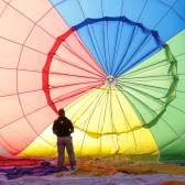 A balloon being inflated by an attendant at Bristol International Balloon Fiesta - credit Paul Box