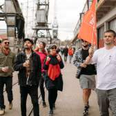 A group of people on the Cider Box walking tour of Bristol outside the M Shed local history museum on Bristol's Harbourside - credit Yuup