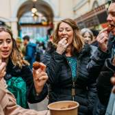 A group of people tasting food in St Nicholas Market on the Bristol Food Tour - credit Yuup