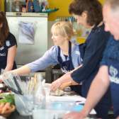 A group of people taking part in a cooking class at Papadeli in Clifton, West Bristol - credit Papadeli