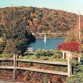 a boat sailing on Lake Redman in the fall