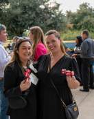 Annual Meeting attendees posing with little airplane giveaways.