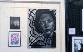 Painting of woman smoking looking at the viewer