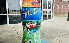 Coke bottle sculpture at the THCVB featuring sports destination tourism