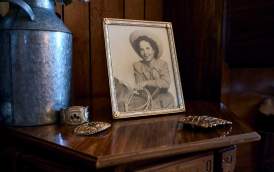 Photograph and buckles on table