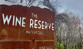Weathered steel entrance sign for The Wine Reserve at Waterford, a winery and vineyard in Loudoun County, Virginia