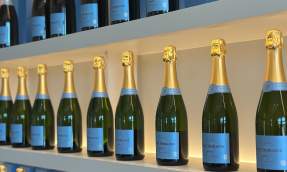 Shelves of Petit Domaine brut and rosé sparkling wine bottles on display at the winery's estate in Loudoun.