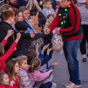 people gathered on the street for the christmas parade