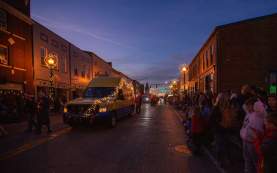 christmas parade in downtown etown street at dusk