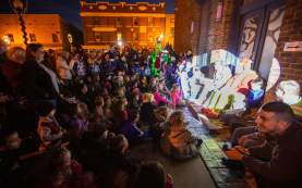 people gathered on the street for light up downtown