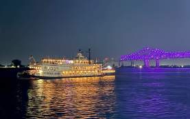 Creole Queen and the Crescent City Connection at Night from the Algiers Ferry