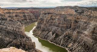 Dramatic cliffs and water below at Bighorn Canyon National Recreation Area in Big Horn County, Wyoming.