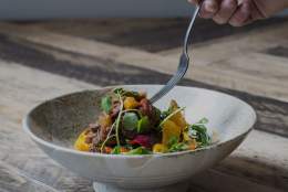 A white plate with healthy food.