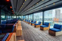 A view along the Skyline Terrace atop the Cube in Birmingham, with views of the skyline through the long windows on the right