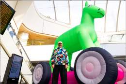 Bruce Asbestos in front on his inflatable sculpture 'Faster Horse'