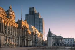 Early morning in Victoria Square, Birmingham, showing council house and statue of Queen Victoria in front of 103 Colmore Row in the distance.