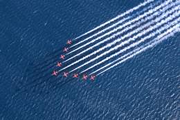 The Red Arrows flying over the sea at Sidmouth Air Show and Regatta