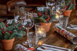 christmas dinner table with christmas crackers
