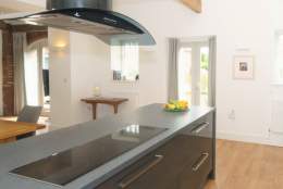 A modern grey kitchen at The Plovery at Church Farm Cottages in East Yorkshire.