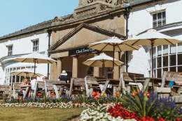 People sat outside the Clock Tower Cafe at Sewerby Hall