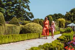 A mother and daughter strolling through one of the colourful gardens at Sewerby Hall in Bridlington