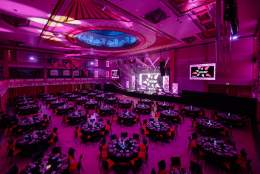 A shot of the REYTAs ceremony room, including tables, lighting and stage
