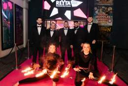 guests and fire performers on the pink carpet at the REYTAs 2024