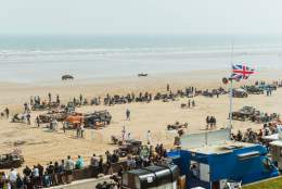 a view of the racing from the road looking over the beach