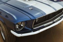 close up of a bonnet of a blue car