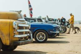 cars parked up on the beach at Race the Waves