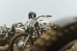 motorbikes parked up on the beach at race the waves