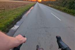 A view of a sunset from a bike