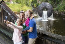 Family selfie in front of one of the water sculptures at Kistefos