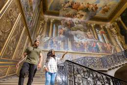 Visitors enjoy the interior of Hampton Court Palace
