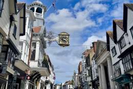 Guildford High Street showing clock and historic architecture