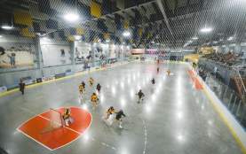 Ariel shot of a female minor lacrosse team playing.