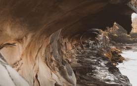 A curved sandstone cliff.
