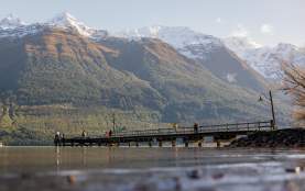Glenorchy Wharf in winter on a bluebird day with snow capped peaks