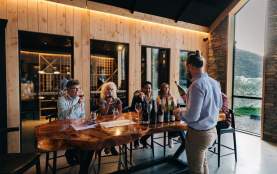A group of people attending a wine tasting at Kinross in Gibbston near Queesntown
