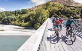 Bikers riding over bridge along the Twin Rivers Trail
