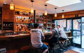Friends enjoying a drink at Cork Bar in Wānaka
