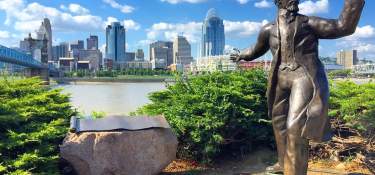 roebling-bridge-cincinnati-skyline-statue-blue-sky-summer-cincyrefined