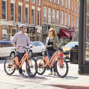 Couple cycling on Galena's Main Street