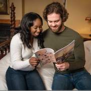 Couple reading Galena Country Visitors Guide