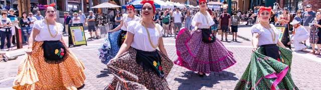 Women dancing for the Latino Arts Festival parade